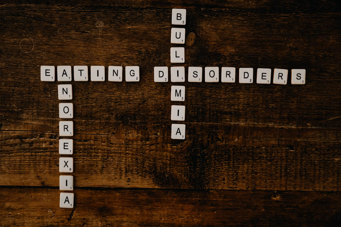 Letter tiles against a wood backdrop